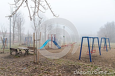 Children`s playground with fog Editorial Stock Photo