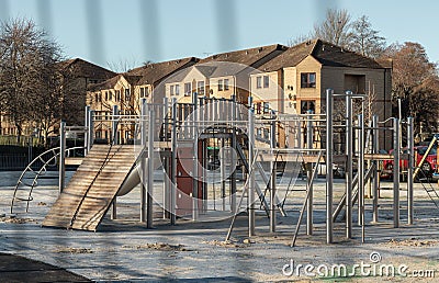 The Children's playground with Slide. Empty outdoor playground with stainless steel equipment for children Stock Photo
