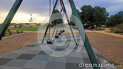 Children's playground swings Stock Photo