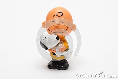 Children`s toy Boy with Snoopy dog on a white background Editorial Stock Photo