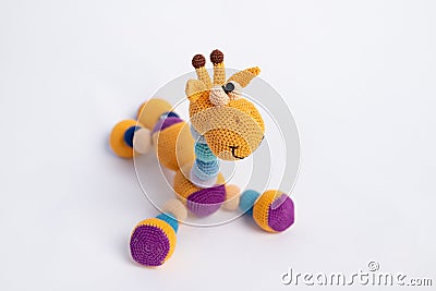 Children`s toy giraffe, handmade orange, place for text Stock Photo