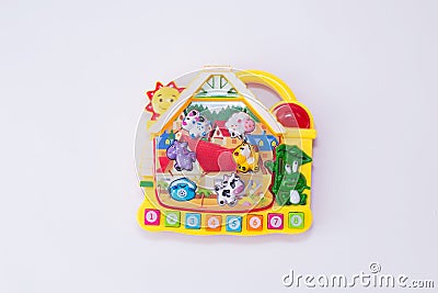 Children toy musical piano with animals and numbers look like house on white background. educational game Stock Photo