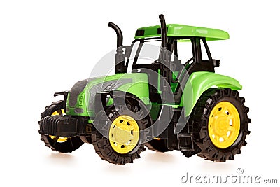 children`s toy small green toy tractor isolated on white Editorial Stock Photo