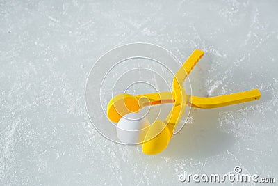 A children`s toy is a tool for modeling snowballs from snow Stock Photo