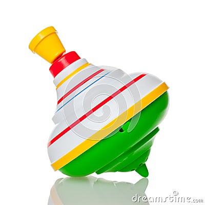 Children`s toy top isolated on a white background, color beautiful bundle, mobile toy for little kids, spinning top, gyroscope, d Stock Photo