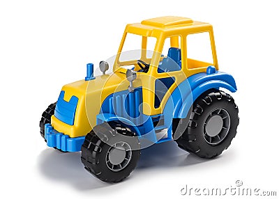 Children`s toy tractor on a white. Stock Photo