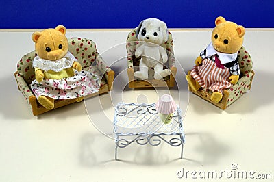 Children's toys bears sit in chairs. Stock Photo