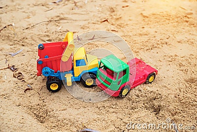 Children`s toys trucks imitate a traffic accident Stock Photo