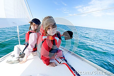 Children sailing on yacht Stock Photo