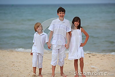 Children on sandy beach Stock Photo