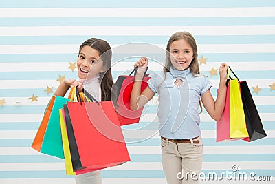 Children satisfied shopping striped background. Obsessed with shopping and clothing malls. Discount concept. Kids cute Stock Photo