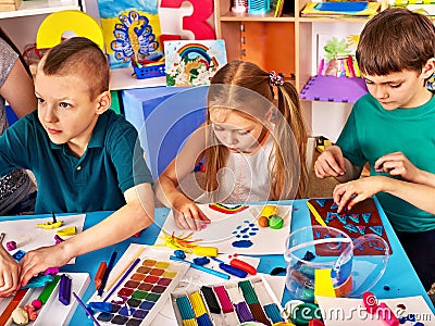 Children sculpt from clay and draw Stock Photo