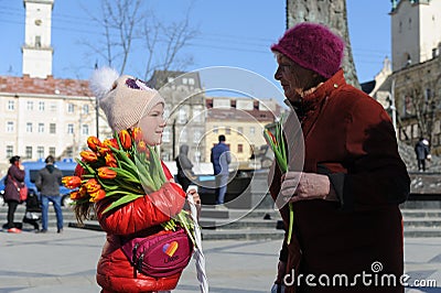 Ukrainian children sell flowers during their action called `Buy flowers and support our defenders` in Lviv Editorial Stock Photo