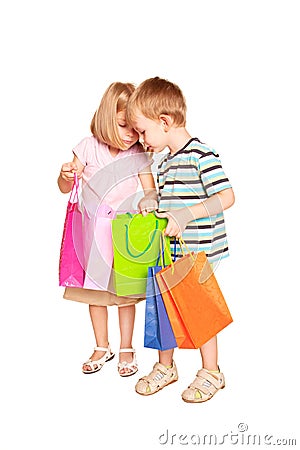 Children shopping. Young couple, little boy and little girl Stock Photo