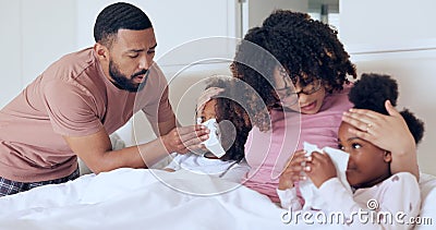 Children, sick and bed with parents, tissue for nose, mom, dad and busy for healthcare, medical and monitor. Family Stock Photo