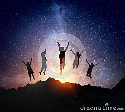 Children silhouette on the night background . Mixed media Stock Photo