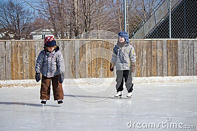 Children at the skating rink Stock Photo