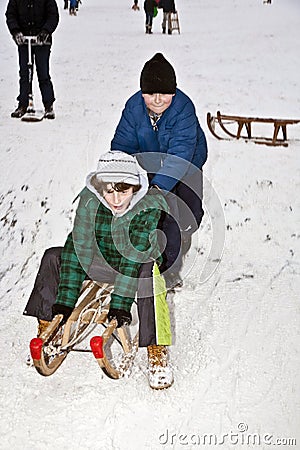 Children are skating at a toboggan Stock Photo