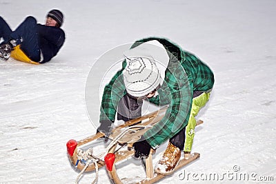 Children are skating at a toboggan Stock Photo