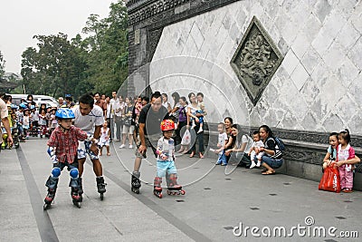 Children skating training with coach in a park,chengdu,china Editorial Stock Photo