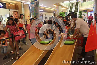 The children sliding board game in the SHENZHEN Tai Koo Shing Commercial Center Editorial Stock Photo