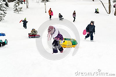 Children Sliding on Snow Slides in Russian Winter Editorial Stock Photo