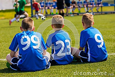 Children Soccer Team Watching Football Match. Children Sport Team in Blue Shirts Editorial Stock Photo