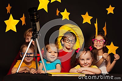 Children studying astronomy with telescope Stock Photo