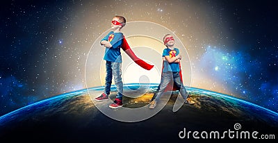 Children in superhero costumes guard the planet. Stock Photo