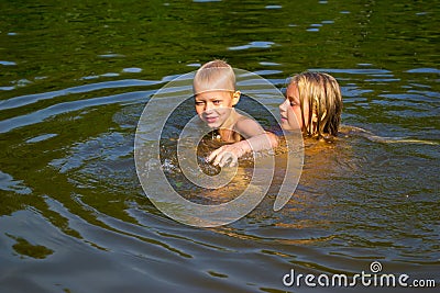 Children swimming in the river Stock Photo