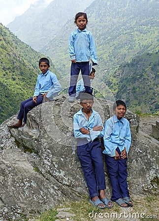 Group of School Children Posing on a Rock in Tallo Chipla, Nepal Editorial Stock Photo