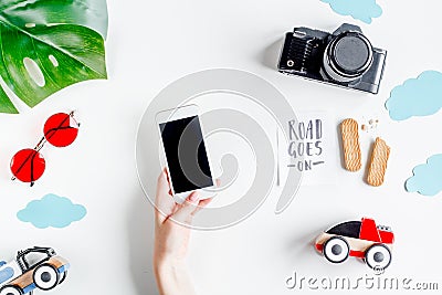 Children tourism outfit with camera and mobile on white background flat lay mockup Stock Photo