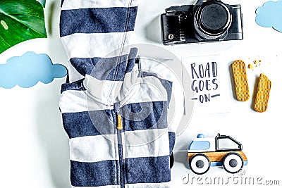 Children tourism outfit with clothes and camera on white background flat lay Stock Photo