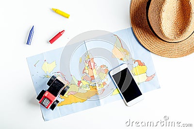 Children tourism outfit with map and phone on white background flat lay mockup Stock Photo