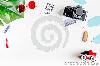 Children tourism outfit with toys and camera on white background flat lay mockup Stock Photo