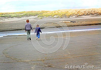 Children walking at beach Stock Photo