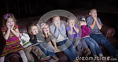 Children watching Shocking Television Programming Stock Photo