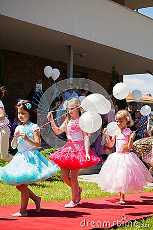Children with white balloons. Editorial Stock Photo