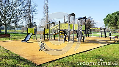 Children yellow playground activities in public green park modern Stock Photo