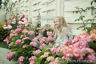 Childrens day. Small baby girl. Summer. Mothers or womens day. New life concept. Spring holiday. Little girl at blooming Stock Photo