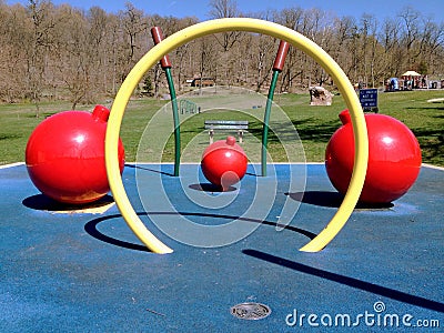 Childrens playground in a park with woods in background Stock Photo