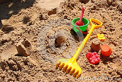 Childrens toys in a sandbox Stock Photo