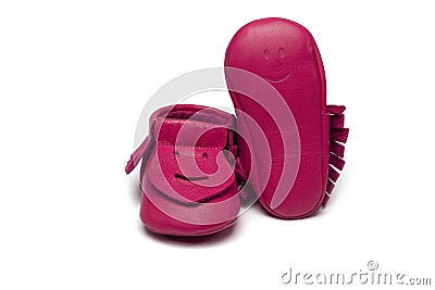 Childs dark pink booties on a white background Stock Photo