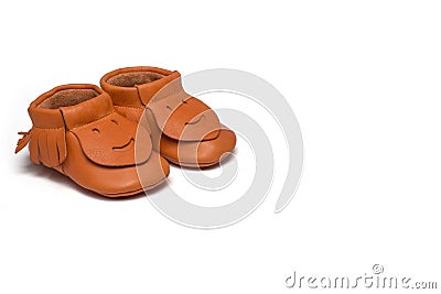 Childs orange booties on a white background Stock Photo