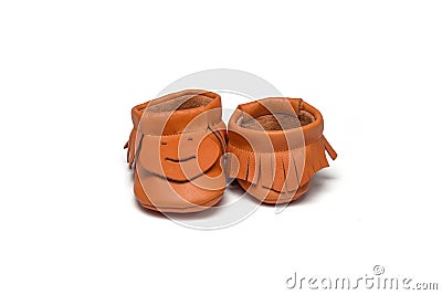 Childs orange booties on a white background Stock Photo