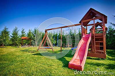 Childs slide and swings Stock Photo