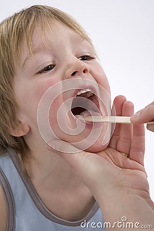 Childs tonsils are checked Stock Photo