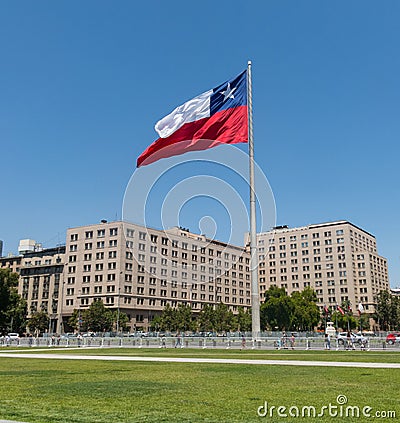 Chileans walking near the giant flag on Avenida La Alameda with the citizenship Square, in downtown Santiago de Chile. Chile Editorial Stock Photo