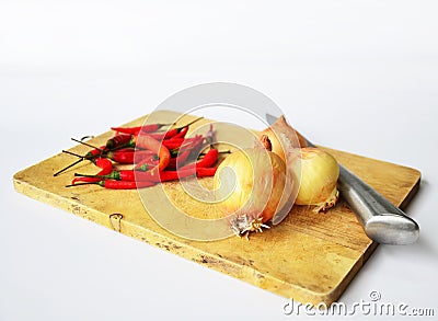 Chili and onion with kitchen tools on white background Stock Photo