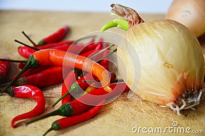 Chili and onion with kitchen tools on white background Stock Photo